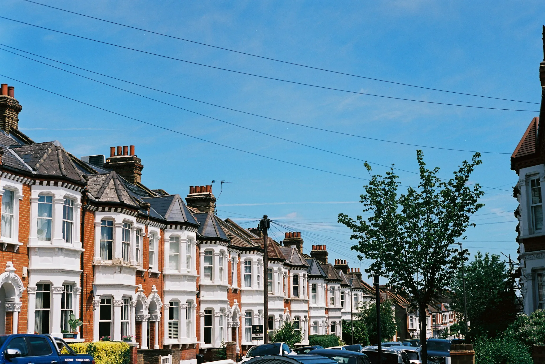 A row of Victorian terraced houses on a sunny Bristol street